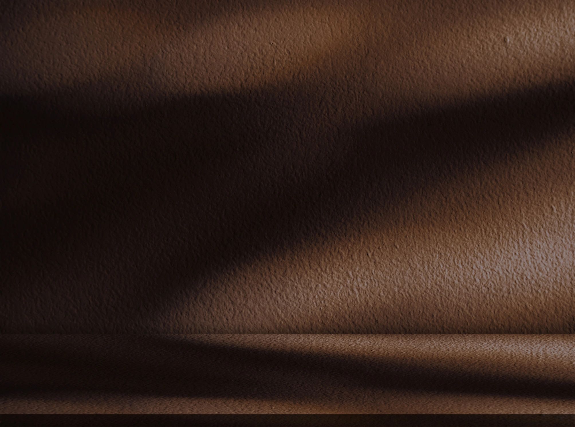 Dark brown studio background with shadow and light